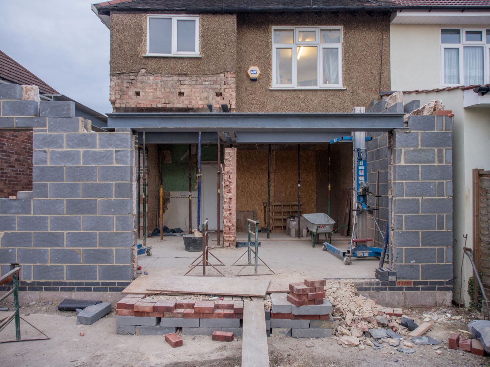 Rear extension under construction with blockwork walls and a structural opening